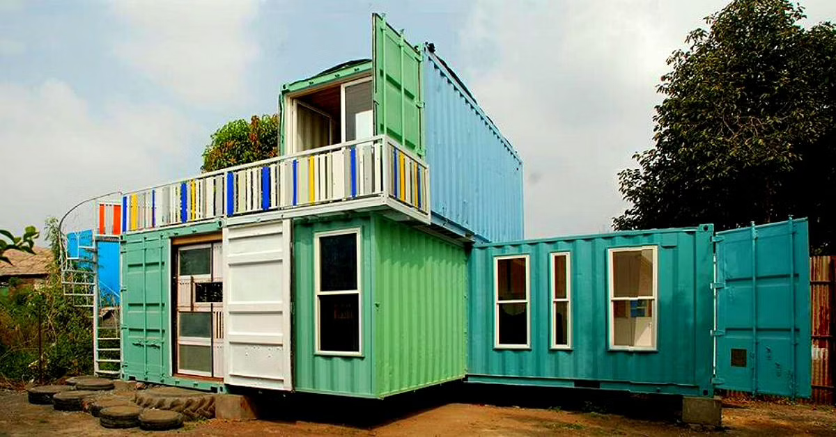 A bright blue and green container house